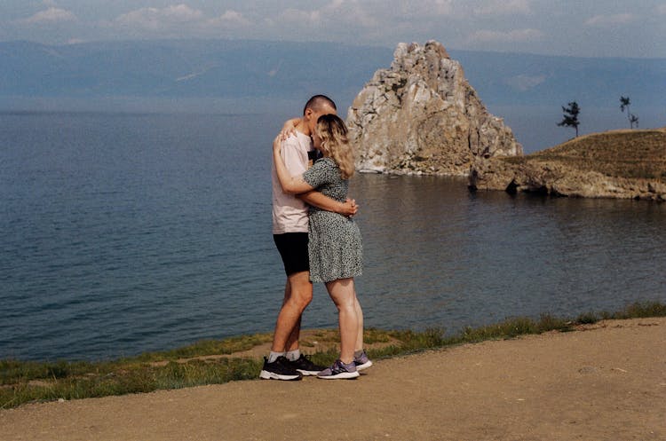 Couple Kissing On Seaside