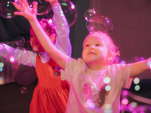 Free Young Girls Playing Bubbles Stock Photo