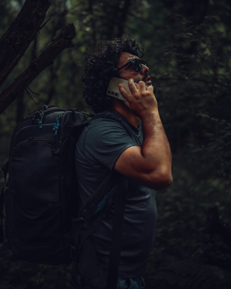 Man In The Forest Walking On The Phone