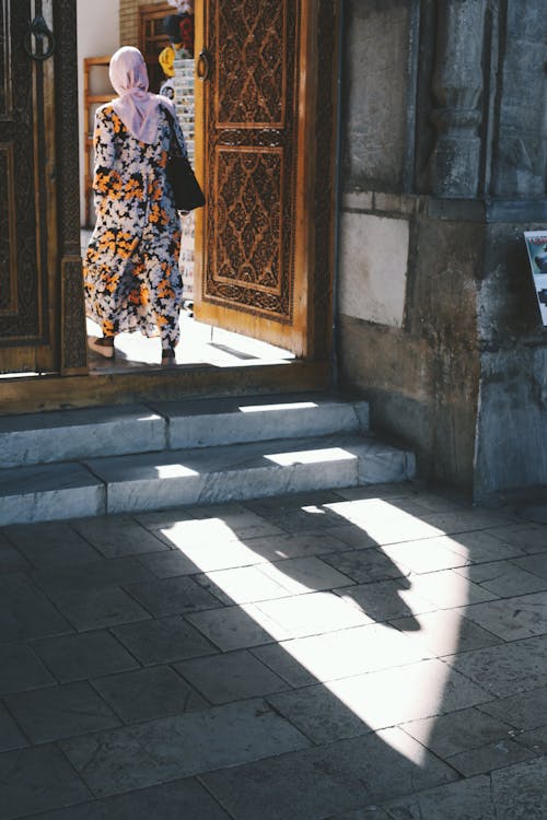 Woman Walking through the Door 