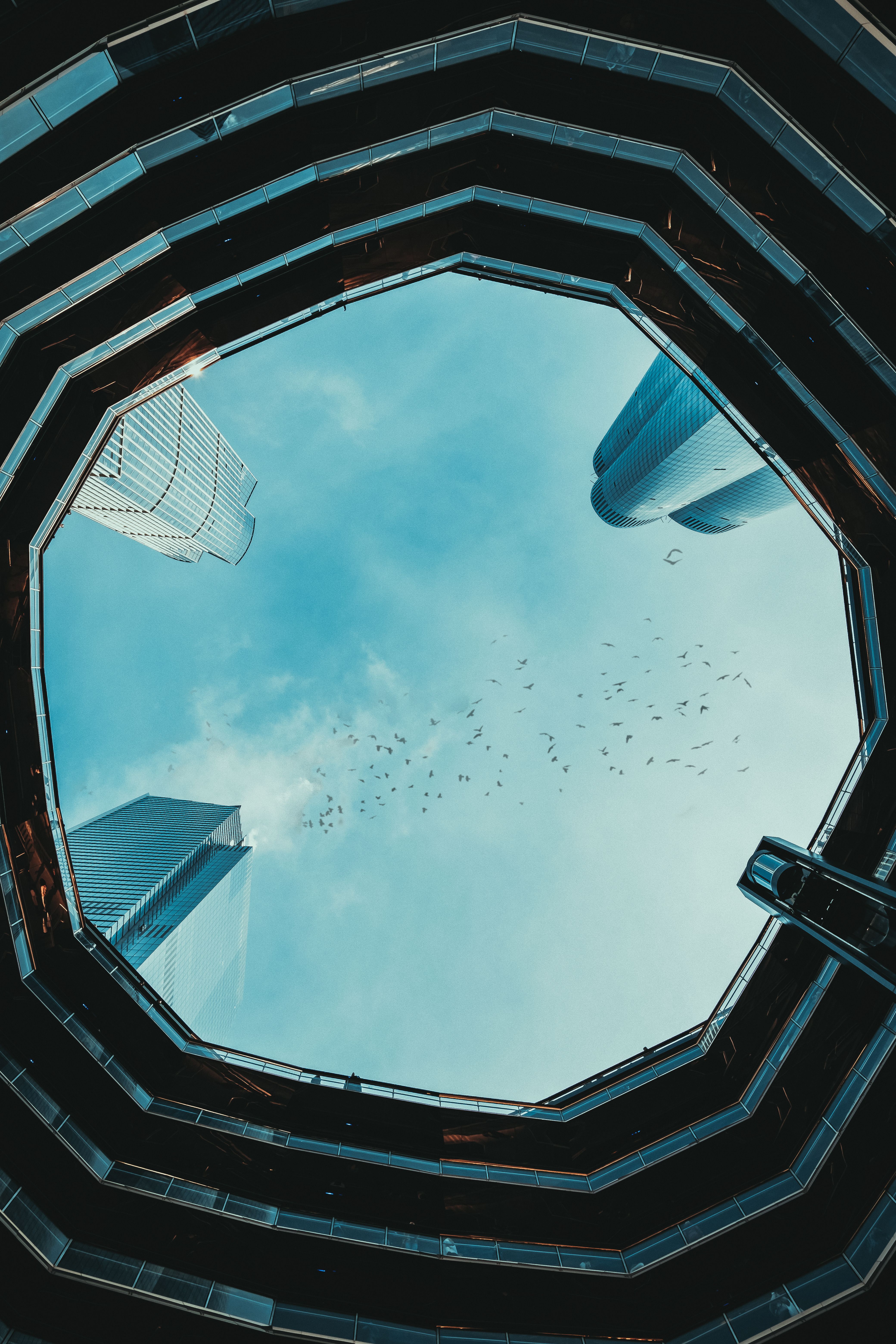 Stunning view of the sky from within the Vessel, showcasing New York's iconic architecture.