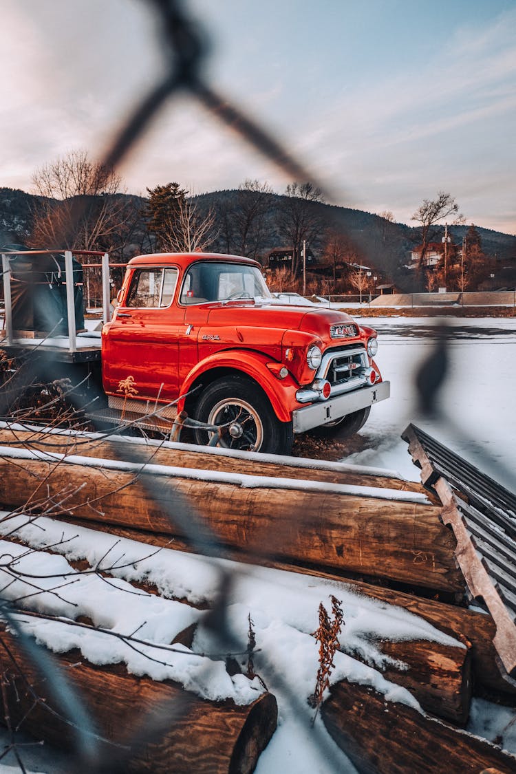 Red Truck On Snow Covered Ground