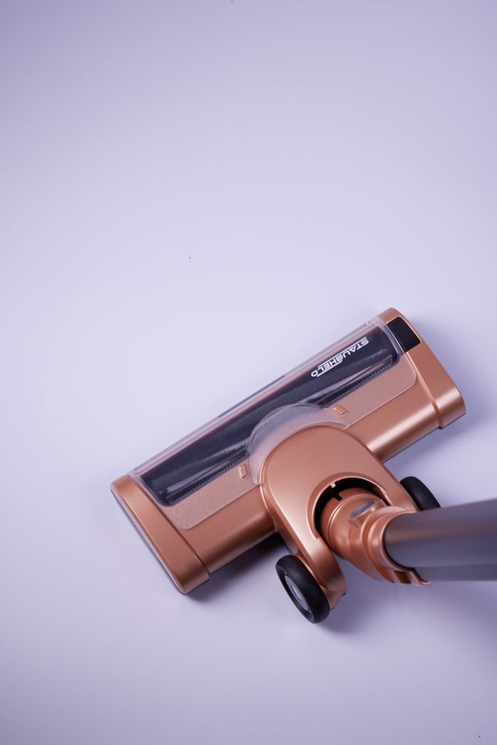 Sleek cordless vacuum cleaner on a white floor