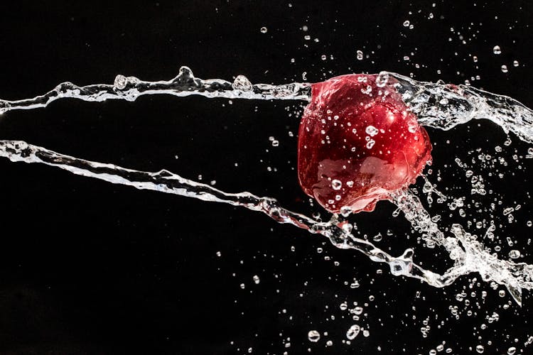 Red Object Splashed With Water