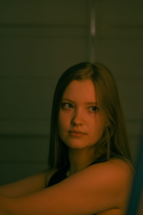 Free Elegant portrait of a woman with soft lighting and a neutral expression indoors. Stock Photo