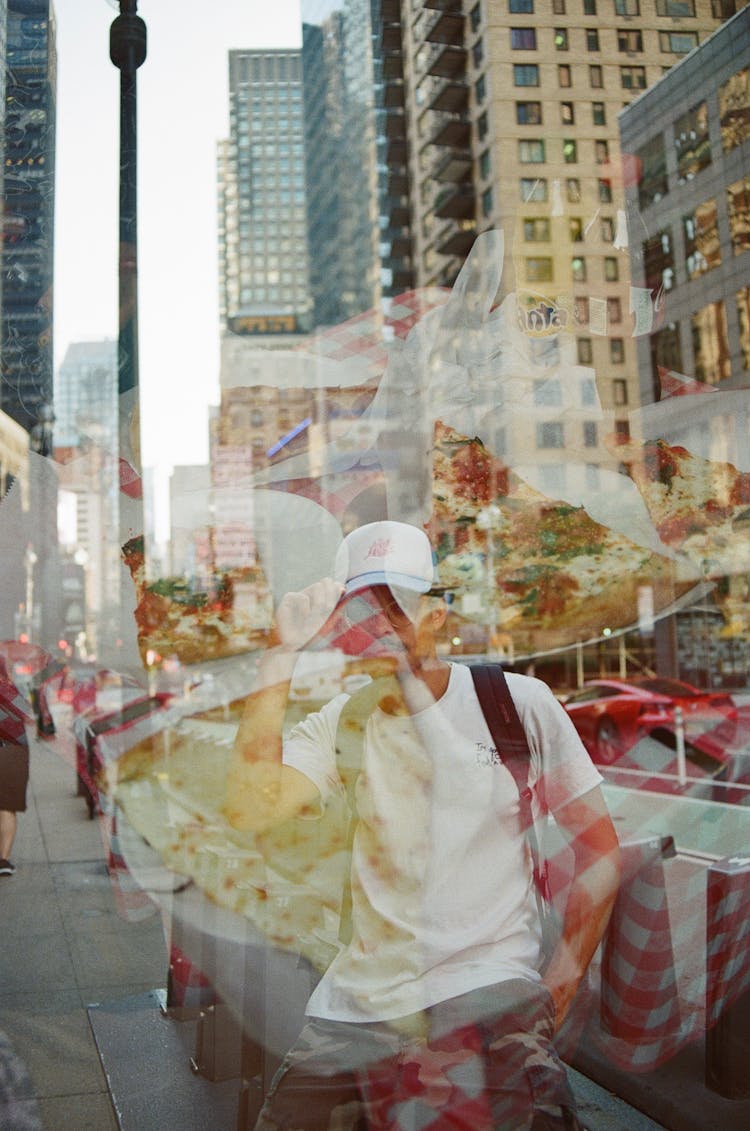 Food And Man On Sidewalk In City