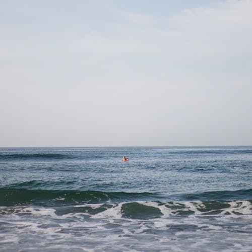 A Person Swimming on the Beach
