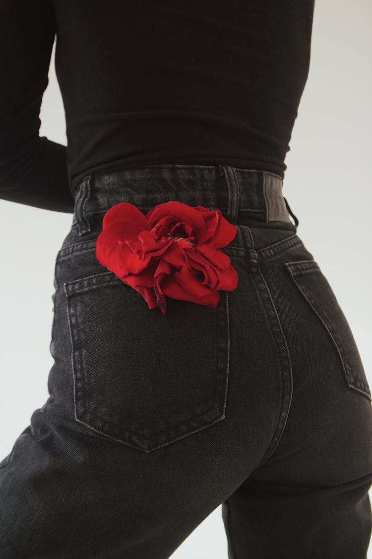 Red Flower In A Pocket Of Jeans