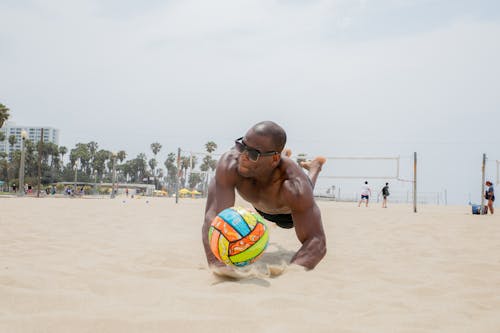 Man Midair Playing Beach Volleyball 