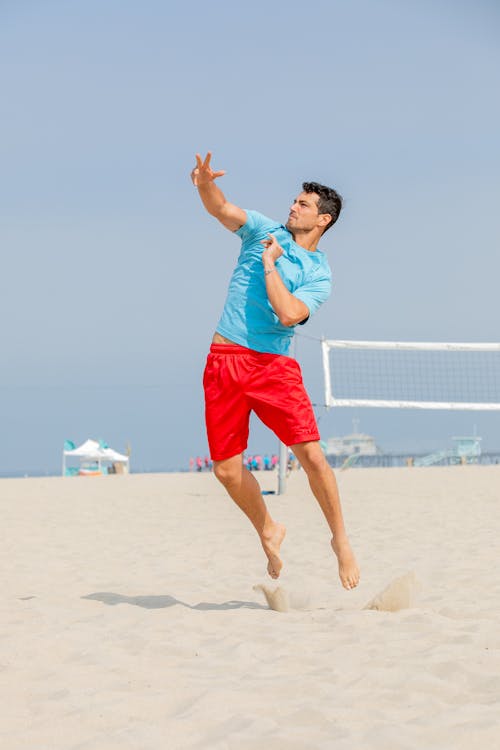 Man Playing Beach Volleyball 