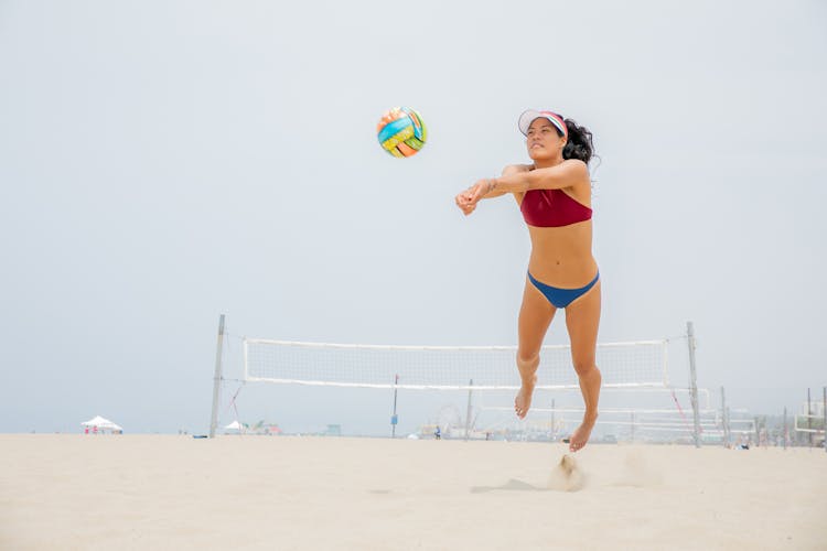 Woman Playing Beach Volleyball 