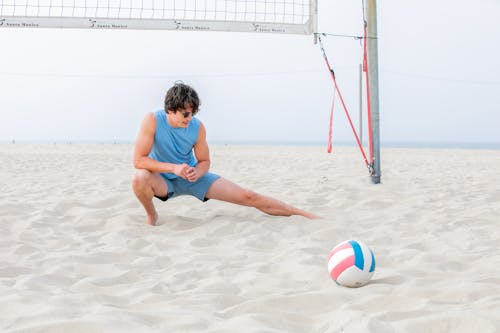 Man Beach Volleyball Player Stretching