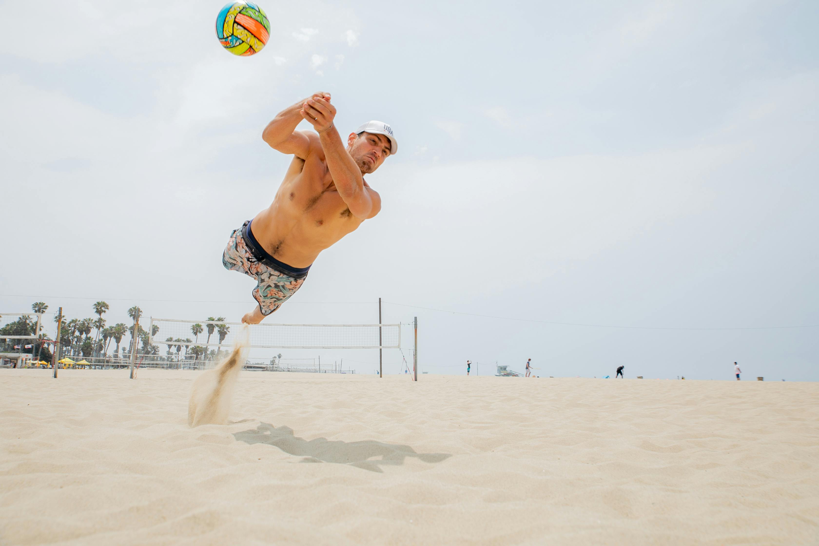 Men playing beach volley ball, Playa del … – License image – 70005127 ❘  lookphotos