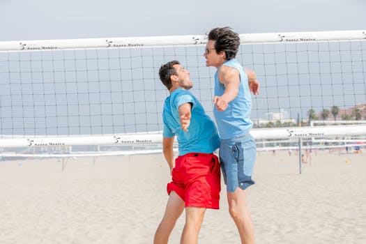 Two men enjoying a sunny game of beach volleyball in Santa Monica.