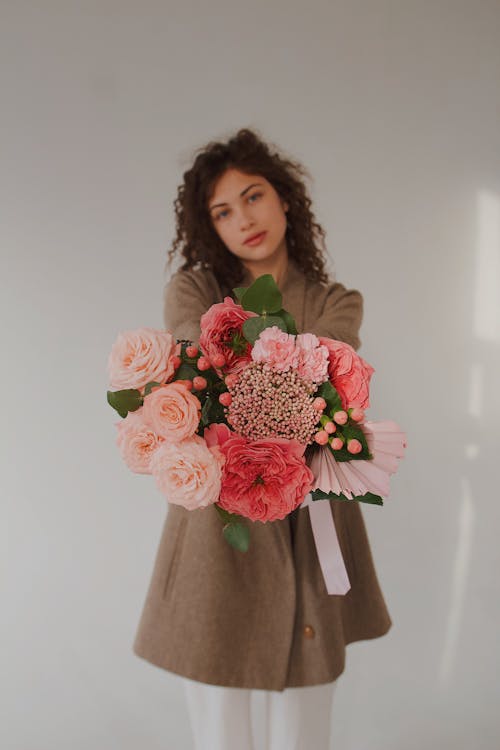Portrait of a Young Woman Holding a Bouquet