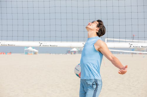 Man Playing Beach Volleyball