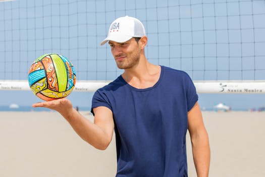 A young man enjoying a game of beach volleyball on a sunny day at Santa Monica.