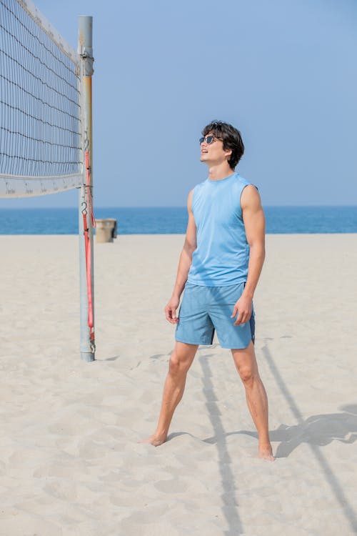 Free Man Playing Beach Volleyball Stock Photo