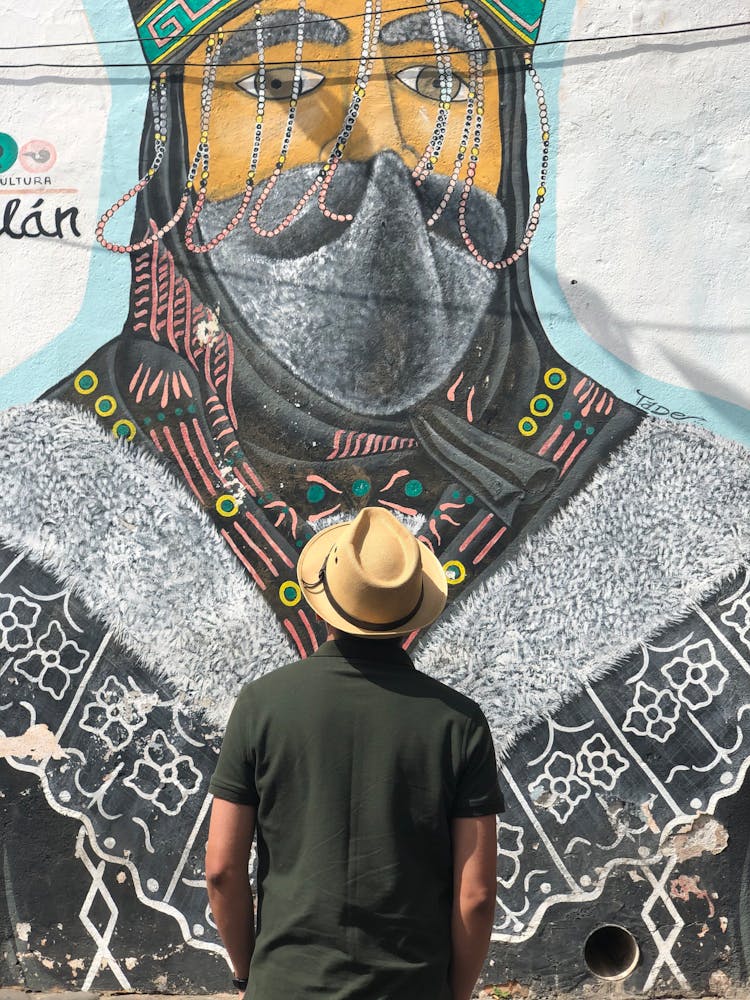 Person Looking At A Mural