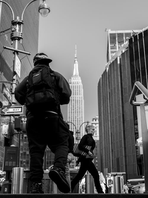 Free Grayscale Photo of People Walking on the City Street Stock Photo