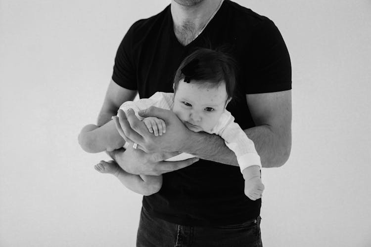 Man Holding A Baby