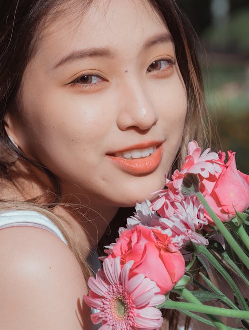 Close-Up Shot of a Woman Smiling 