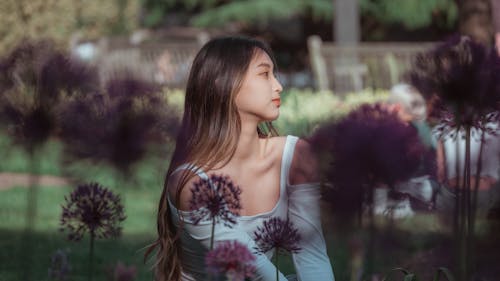 Young Woman Sitting in the Garden 