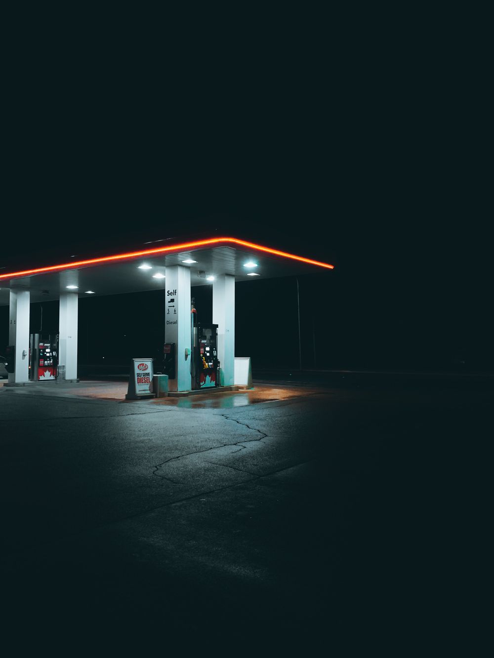 Gas station canopy glowing at night