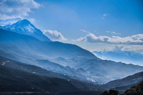 Free Majestic mountain view in Tepelenë, Albania with mist and blue skies. Stock Photo