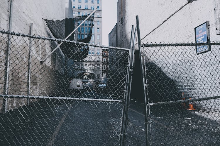 Broken Gate In An Alley