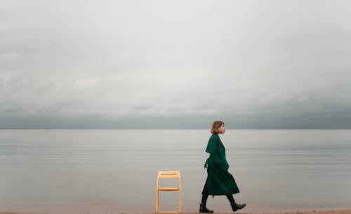 Free Person Walking On Seashore Stock Photo
