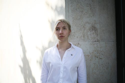 Woman Standing Near Wall