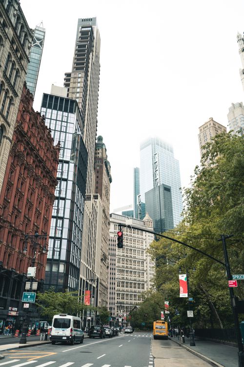 Free Photo showcasing a bustling city with towering skyscrapers and vibrant urban life. Stock Photo