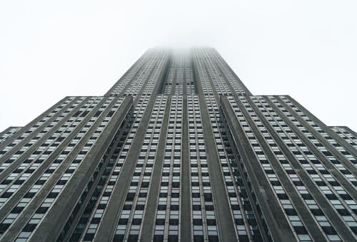 Free Low-Angle Shot of High Rise Building under the White Sky
 Stock Photo