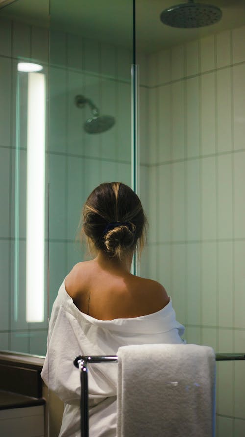 Free Portrait of a Woman in a Bathroom Stock Photo