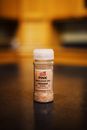 Tesco Garlic Powder Bottle on Brown Table