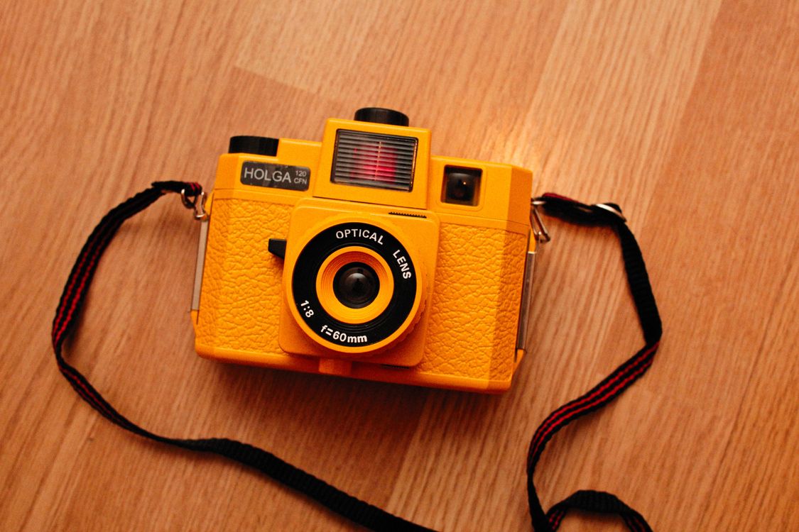 Yellow Camera on Brown Wooden Surface · Free Stock Photo