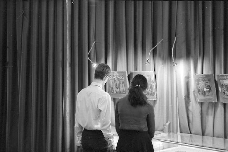 Grayscale Photo Of A Couple Looking At The Museum 