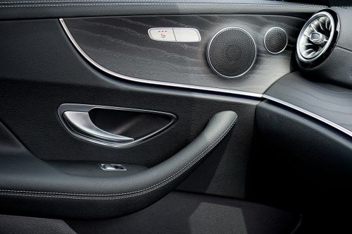 Free Elegant close-up of luxury car interior door panel showcasing design and materials. Stock Photo