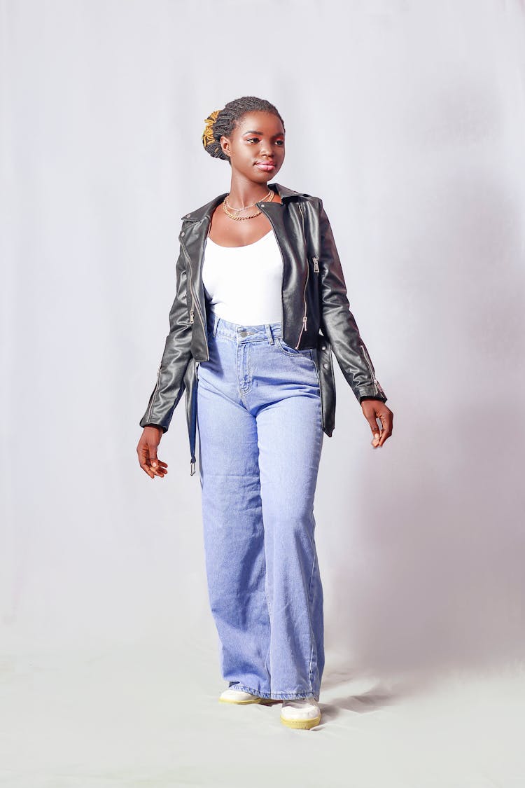 Girl In Casual Outfit Posing In White Studio