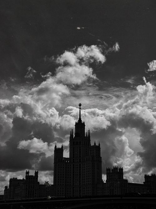 Free Striking monochrome image of a gothic skyscraper silhouette against dramatic clouds. Stock Photo