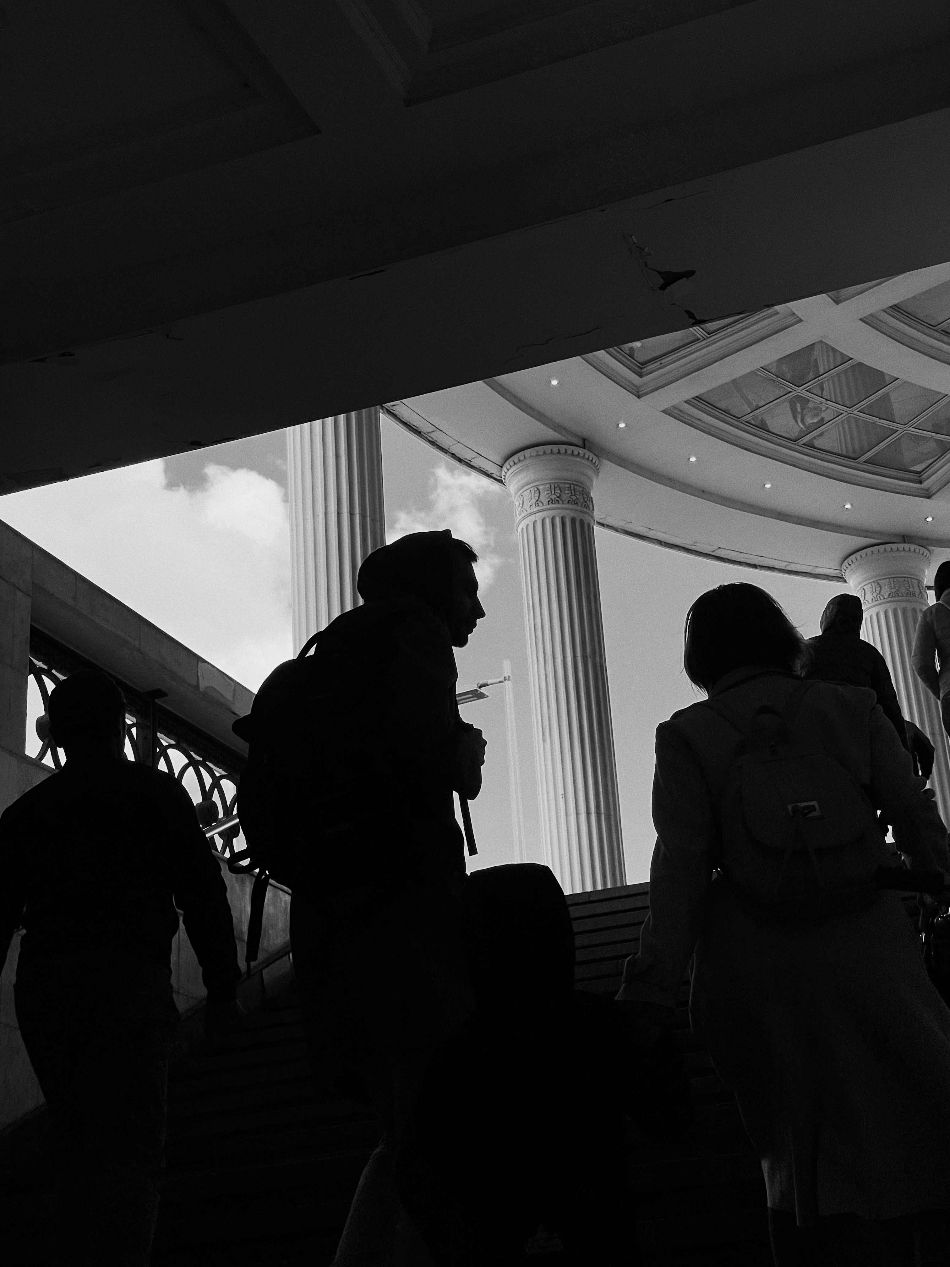 A Woman in Black Dress Standing on the Stairs · Free Stock Photo