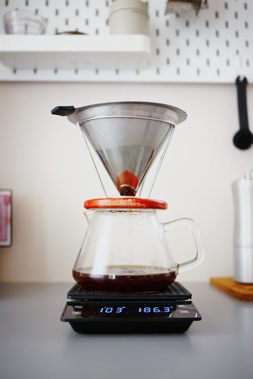 Clear Glass Coffee Maker on a Heating Device