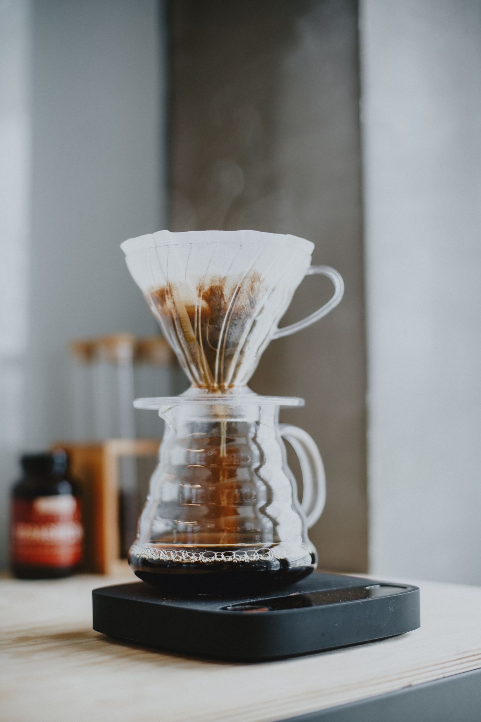 Minimal pour-over coffee brewing equipment with a glass dripper