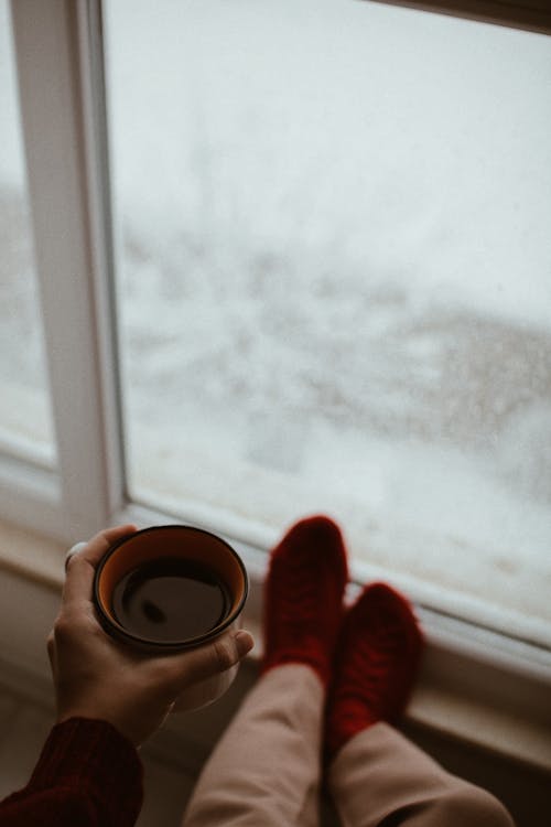 Close-up of Holding a Coffee by the Window · Free Stock Photo