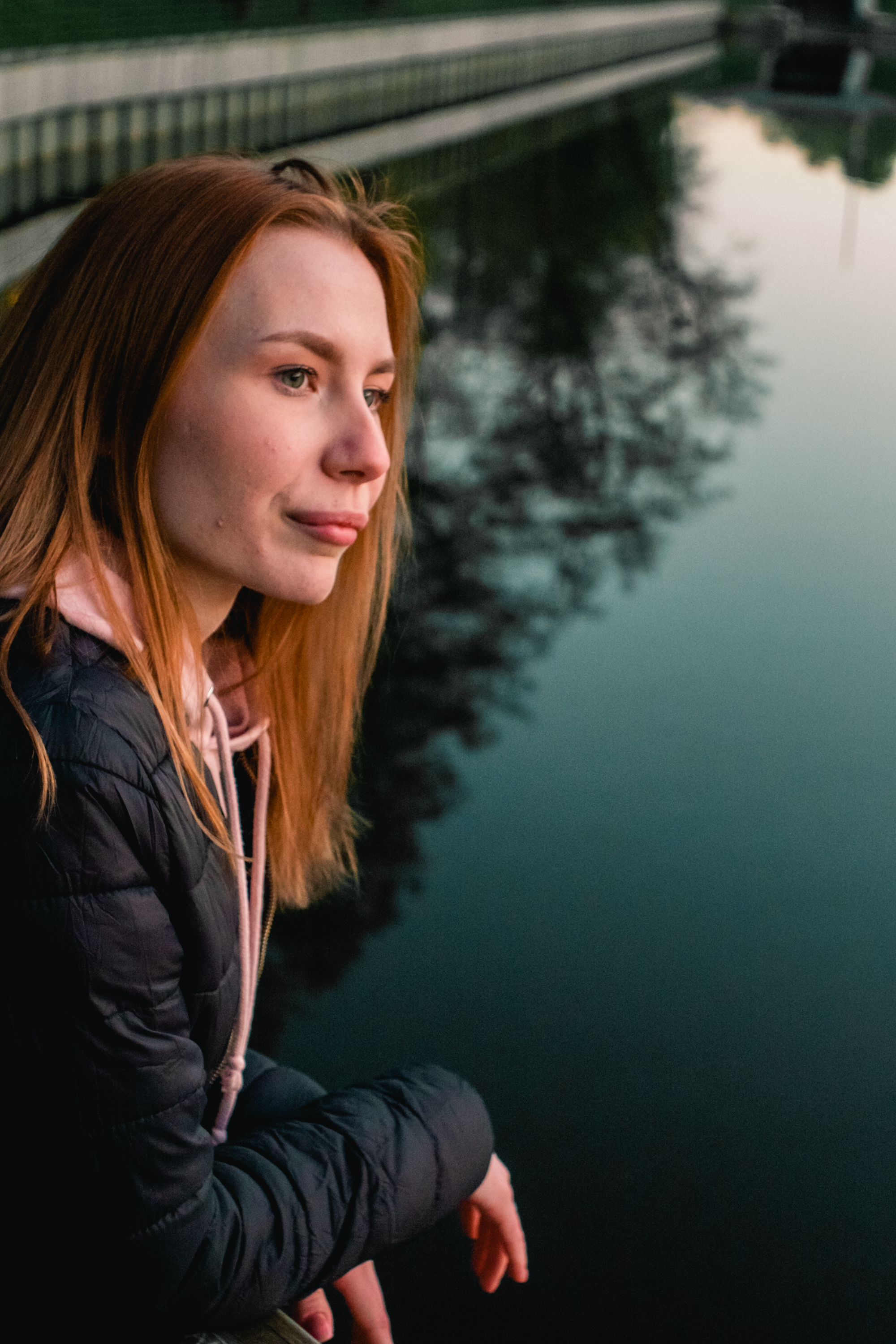A Woman in Black Jacket Standing Near on the River · Free Stock Photo