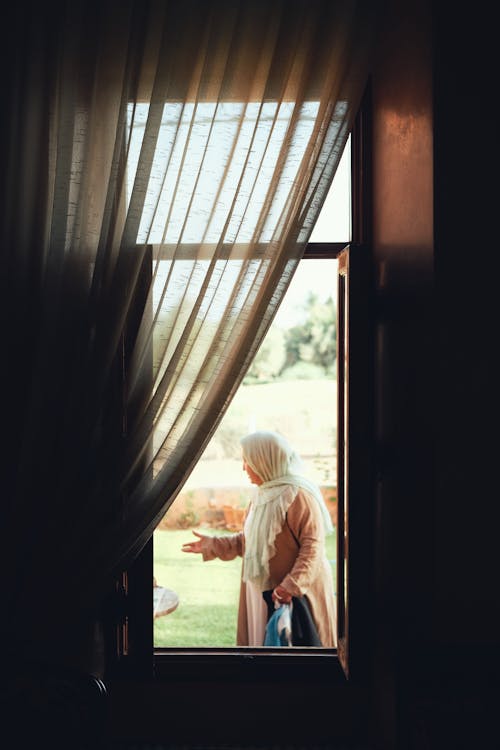 View on Woman from Room Window