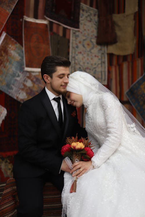 Bride and Groom Sitting and Hugging 