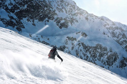 Skier Skiing down the Mountain Slope 