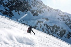 Skier carving through fresh powder — photo by Anselme Courau on Pexels